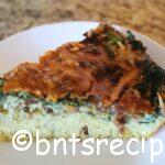 slice of crustless bacon and spinach quiche with cheese