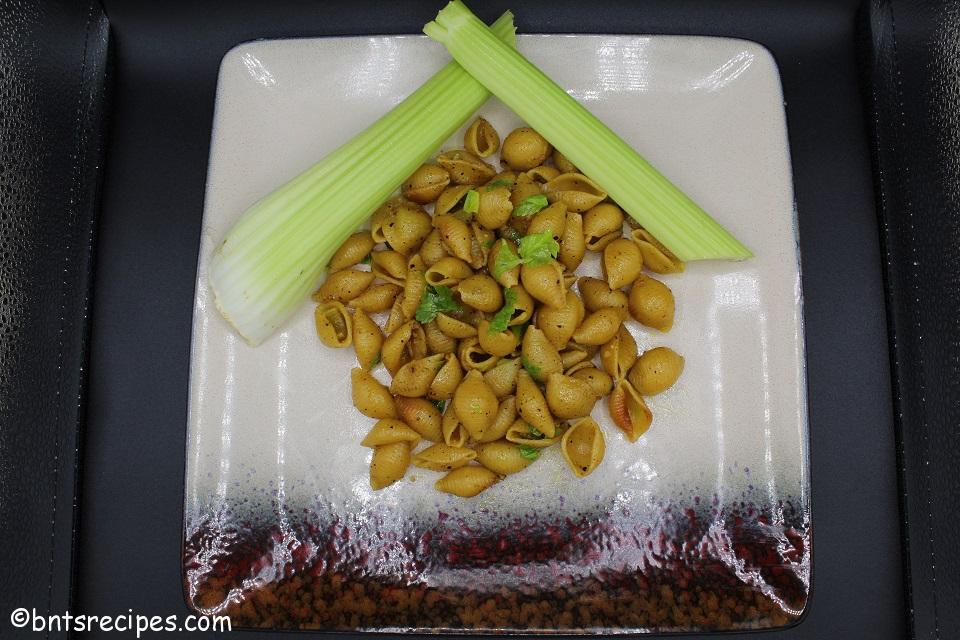 braised celery sticks and leaves with pasta shells