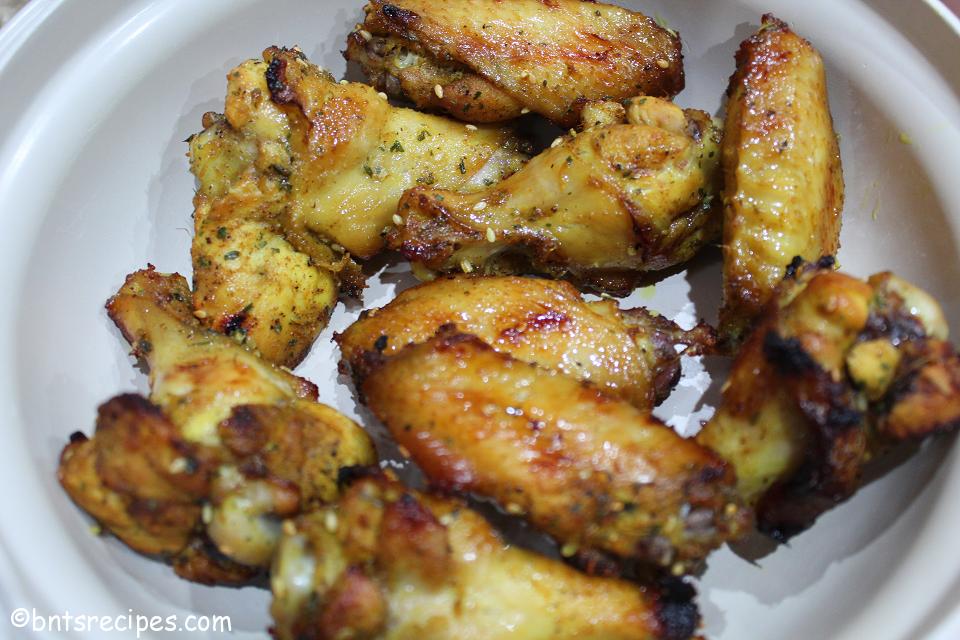 golden brown baked chicken wings with sesame seeds