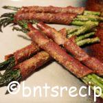 aerial view of baked turkey bacon-wrapped asparagus with parmesan
