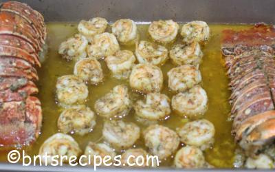 Baked Shrimp and Lobster Tails in Garlic-infused Butter