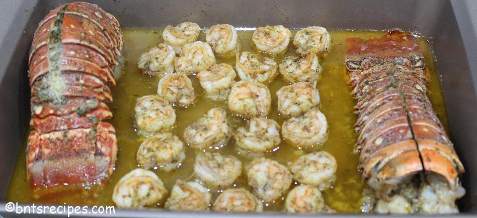 Baked Shrimp and Lobster Tails in Garlic-infused Butter